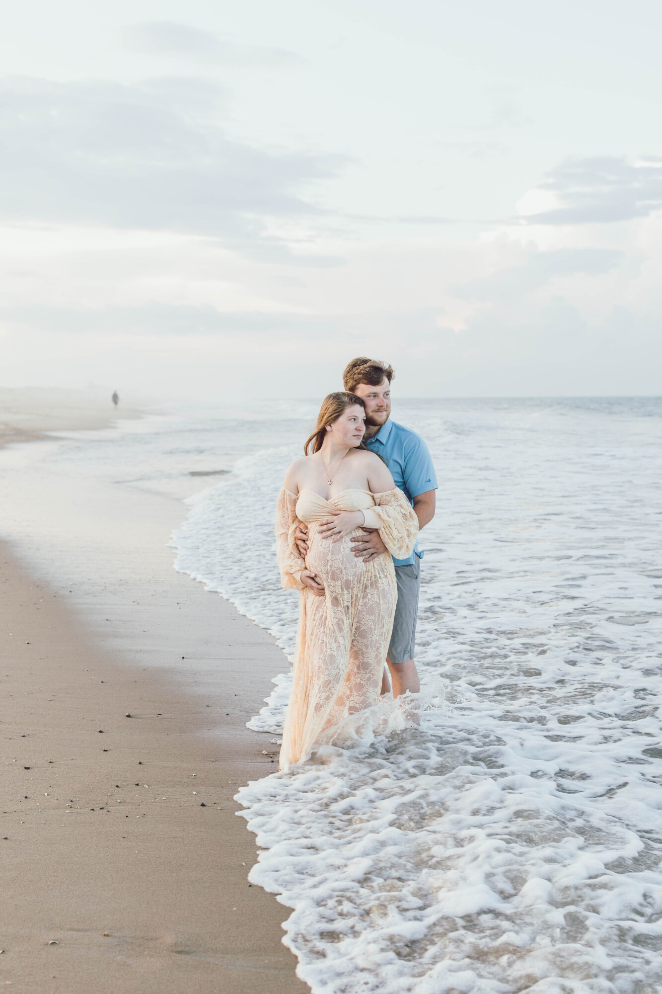 Couple portrait on Fenwick Island beach at sunset