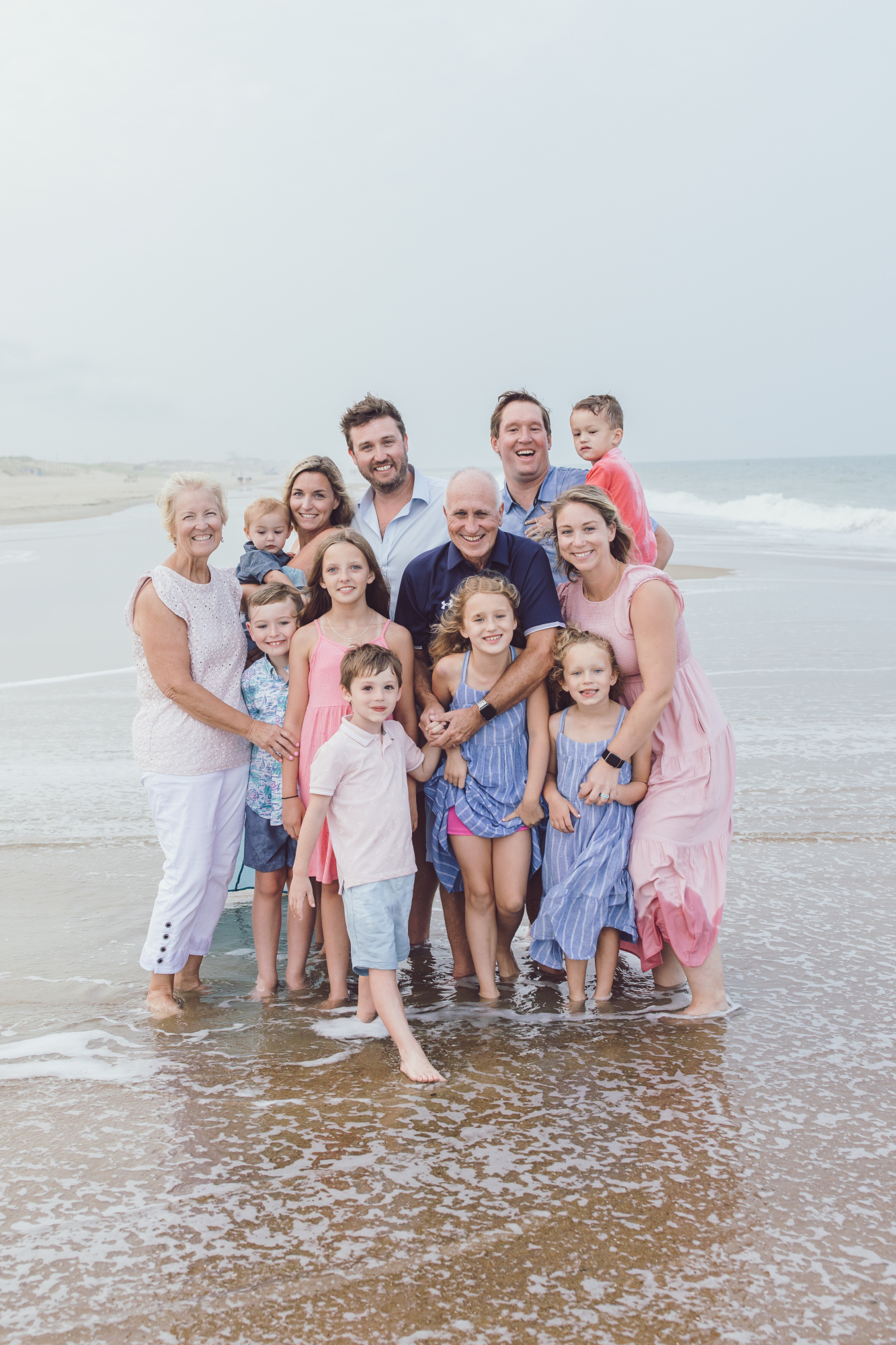 Family laughing together on Fenwick Island