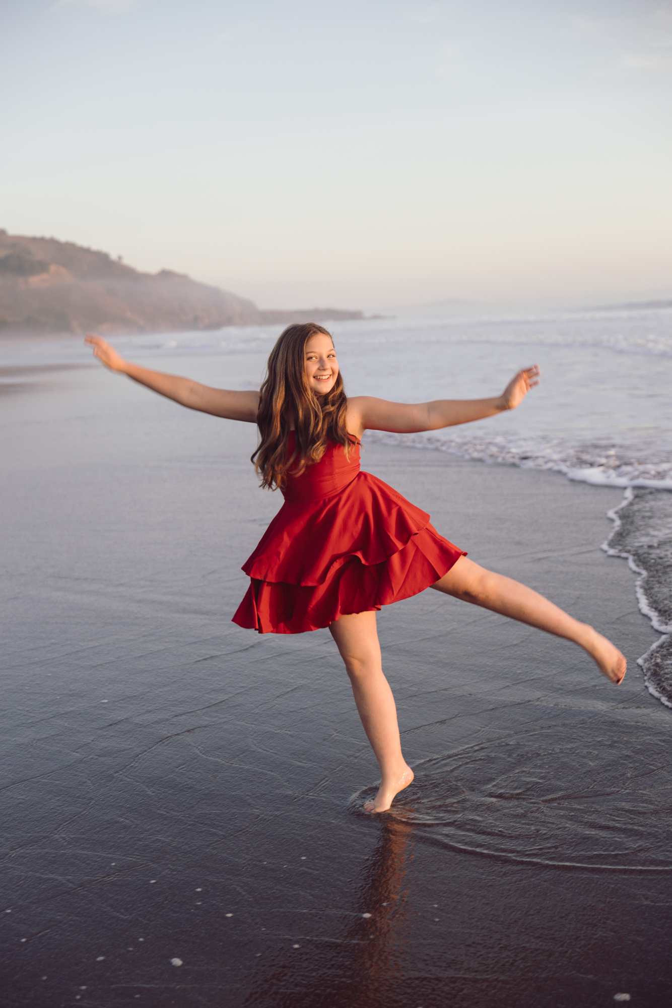 Playful ocean portrait during Fenwick Island family session