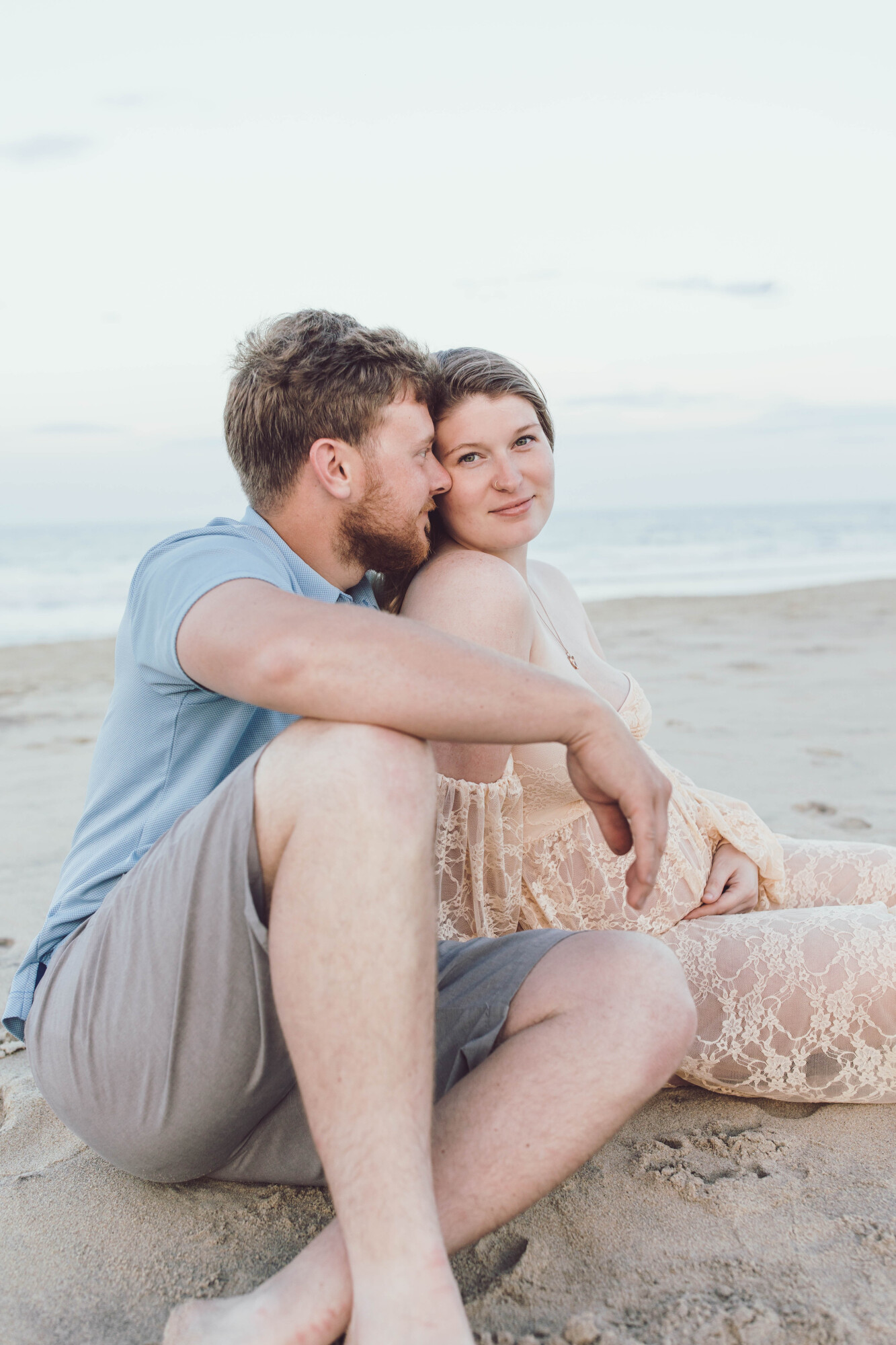Sunset couple portrait on Fenwick Island shore