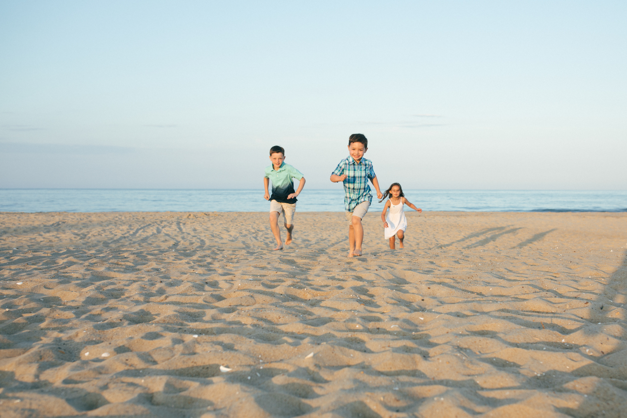 Family at sunset on Fenwick Island Delaware